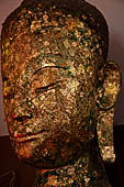 Ayutthaya, Thailand. Viharn Phra Mongkhon Bophit, Buddha heads covered in gold leaves. 